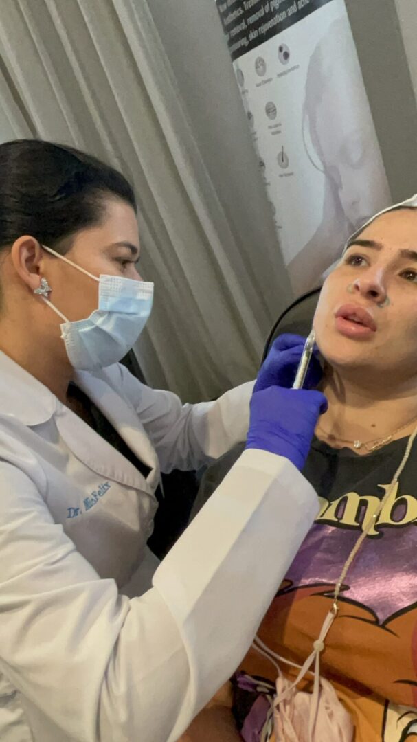 A woman is getting her nose hair cut