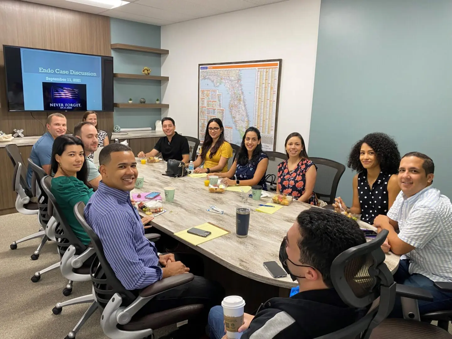 A group of people sitting around a table.