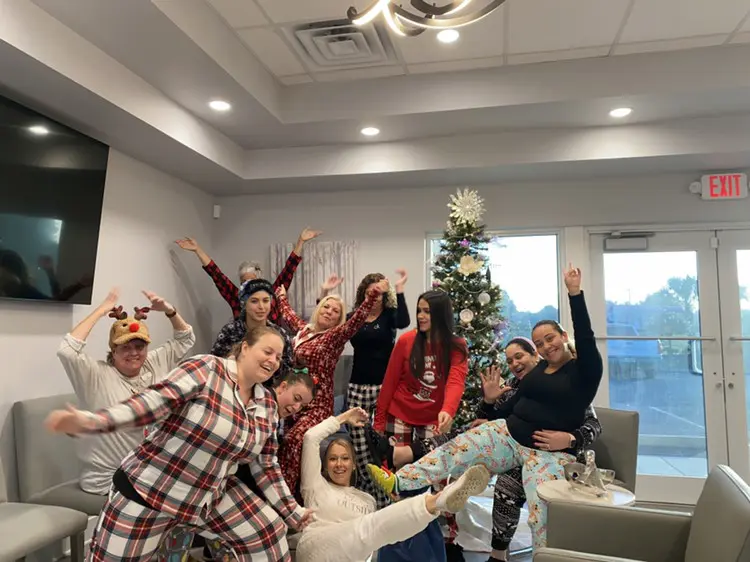 A group of people in pajamas posing for the camera.