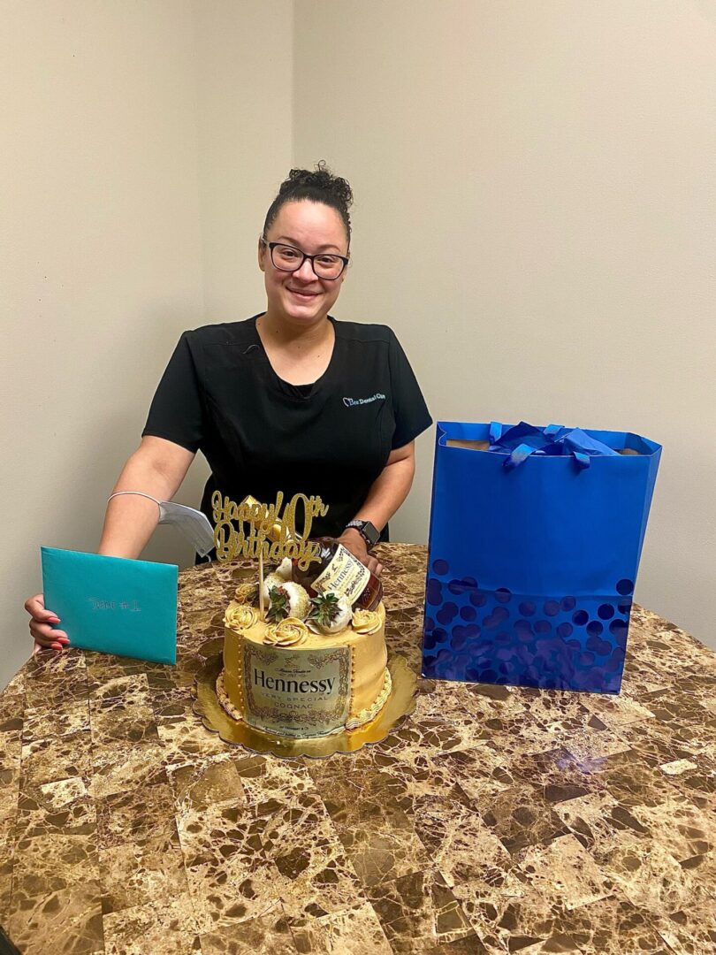 A woman sitting at the table with some gifts