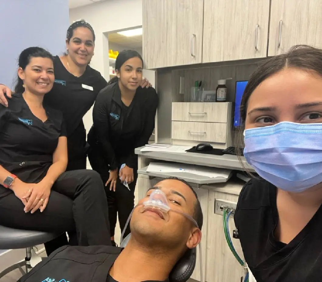 A group of people in the dentist 's office.