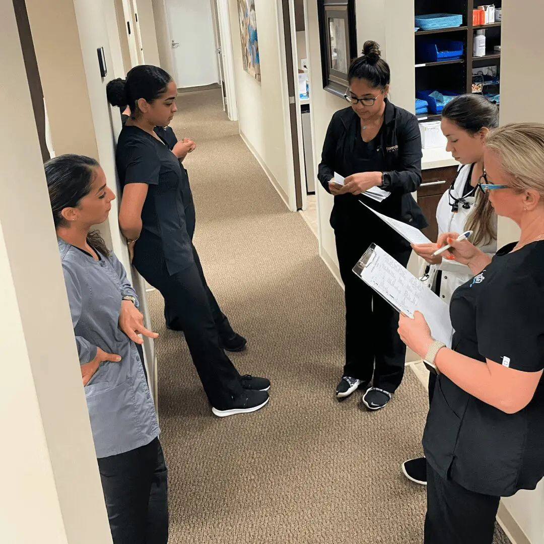 A group of nurses standing in the hallway