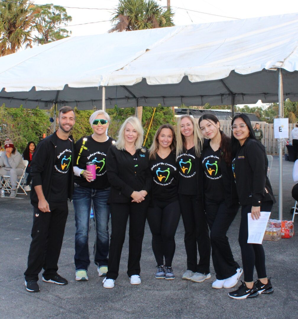 A group of people standing next to each other.