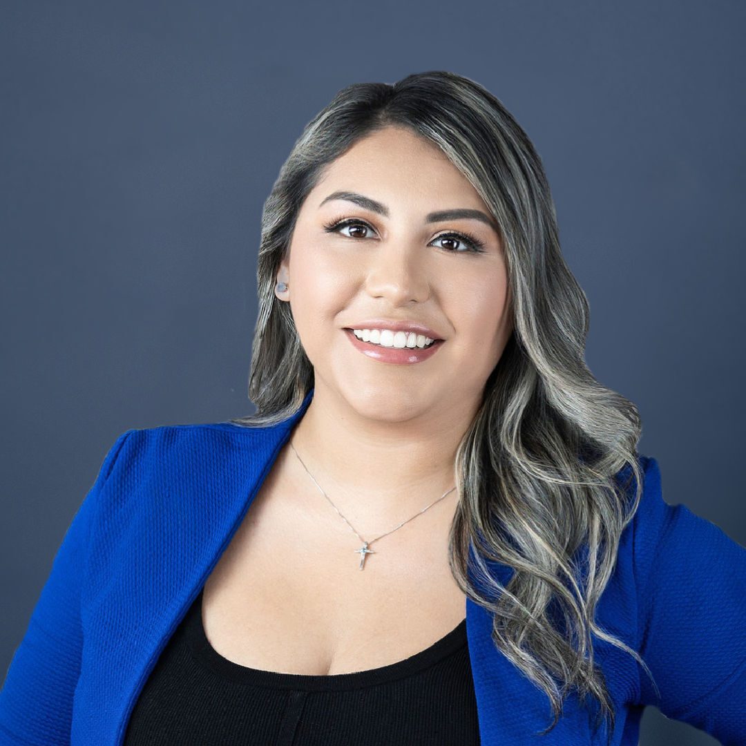 Smiling young woman in black dress and blue jacket, Ashley, HR Director